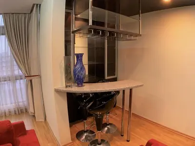 a table with a blue vase on it in a room at #PERFECT# Location BUKIT BINTANG Apartment in Kuala Lumpur