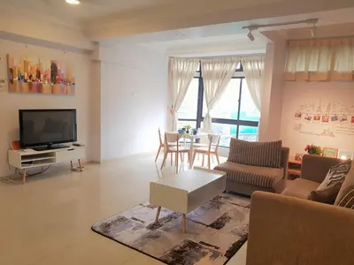 a living room with a couch and a tv and a table at #PERFECT# Location BUKIT BINTANG Apartment in Kuala Lumpur