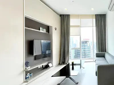 a living room with a couch and a tv at The Platinum KLCC 2 in Kuala Lumpur