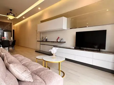 a living room with a couch and a flat screen tv at Dorsett Residences Bukit Bintang in Kuala Lumpur