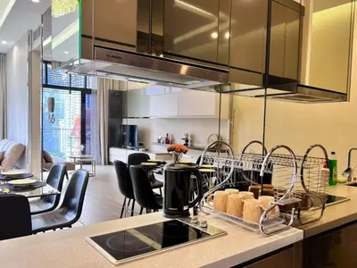 a kitchen with a counter with a dish drying rack at Dorsett Residences Bukit Bintang in Kuala Lumpur