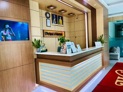 a bar in a hotel lobby with a television at Prime Hotel at TRX Tower in Kuala Lumpur