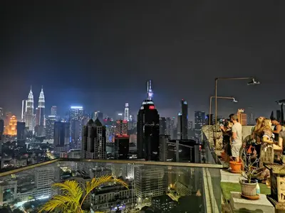 a view of a city skyline at night at Penthouse on 34 - The Highest Unit and Best Views in Regalia & Private Rooftop Terrace in Kuala Lumpur