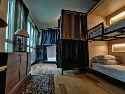 a bedroom with two bunk beds and a rug at Penthouse on 34 - The Highest Unit and Best Views in Regalia & Private Rooftop Terrace in Kuala Lumpur