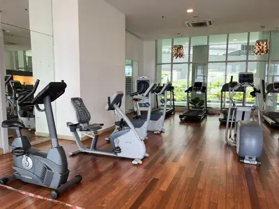 a gym with a bunch of exercise bikes in a room at Regalia Suites & Residence by Enjoy your stay in Kuala Lumpur