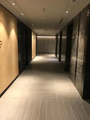 an empty corridor in a building with a long hallway at Tropicana The Residence, KLCC in Kuala Lumpur