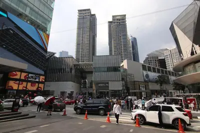 a busy city street with traffic cones and cars at Pavilion Fahrenheit 88 Bukit Bintang 3 bedrooms in Kuala Lumpur