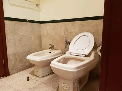 a bathroom with a toilet and a bidet at New Town Suite At Times Square in Kuala Lumpur