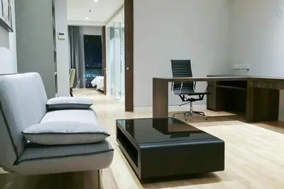 a living room with a desk and a chair at D'Majestic by Plush in Kuala Lumpur