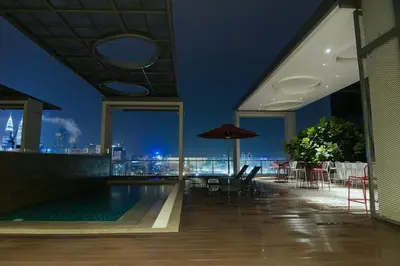 a pool on the roof of a building at D'Majestic by Plush in Kuala Lumpur