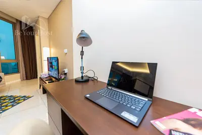 a laptop computer sitting on top of a desk at Dorsett Residences Sri Hartamas in Kuala Lumpur
