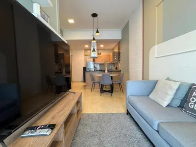 a living room with a couch and a television at 231TR by Plush in Kuala Lumpur