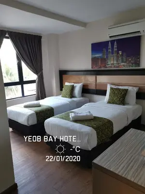 a hotel room with two beds and a window at Yeob Bay hotel Ampang in Ampang