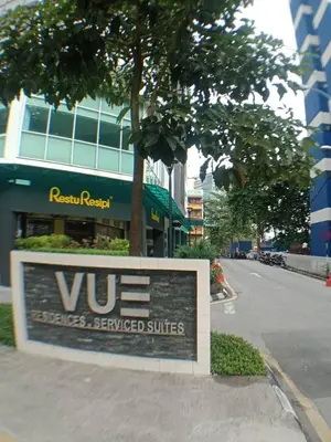 a sign on a street in front of a building at VUE RESIDENCE SERVICE SUITE - Studio 3 pax in Kuala Lumpur