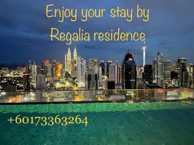 a view of a city skyline at night at Regalia suites & residence 2 bedroom apartment by Enjoy your stay in Kuala Lumpur