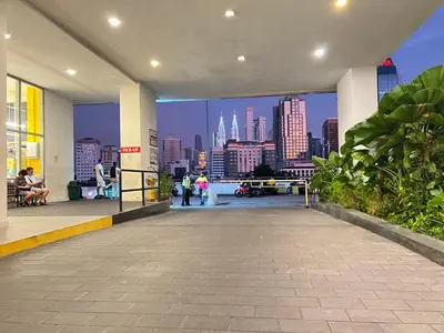 a building with a view of a city skyline at Regalia suites & residence 2 bedroom apartment by Enjoy your stay in Kuala Lumpur