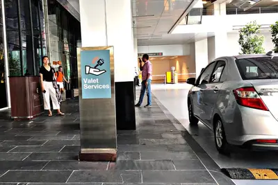 a car parked in front of avent services sign in a mall at La Platinum KLCC in Kuala Lumpur