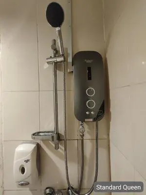 a soap dispenser on the wall of a bathroom at SCC Hotel City Centre in Kuala Lumpur