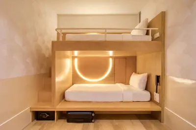 a small room with two bunk beds in it at MoMo's Kuala Lumpur in Kuala Lumpur