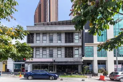 a blue car parked in front of a building at Ceria Hotel in Kuala Lumpur
