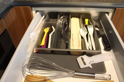 a tupperware drawer with utensils in it at Damai 88 by Moka near KLCC in Kuala Lumpur