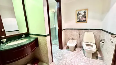 a bathroom with a sink and a toilet and a shower at RJ Service Suite at Times Square in Kuala Lumpur