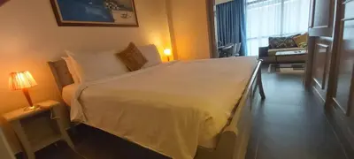a bedroom with a large white bed in a room at Rihanna service suite at times square in Kuala Lumpur
