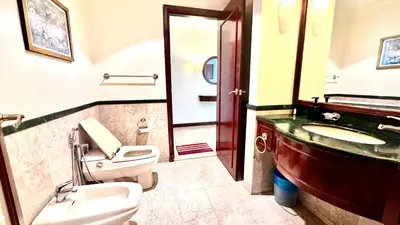 a bathroom with a toilet and a sink and a mirror at Rihanna service suite at times square in Kuala Lumpur
