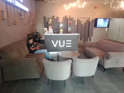 a man sitting on a couch in a store at VUE RESIDENCES Jln Pahang, KL city - 2 ROOM - 4 pax in Kuala Lumpur