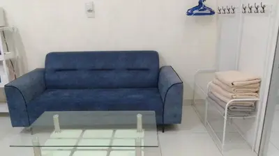 a blue couch in a living room with a glass table at VUE RESIDENCES Jln Pahang, KL city - 2 ROOM - 4 pax in Kuala Lumpur