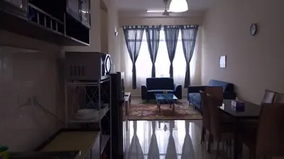 a living room with a couch and a tv at VUE RESIDENCES SERVICE SUITE 2 ROOMS DELUXE 6 Pax in Kuala Lumpur