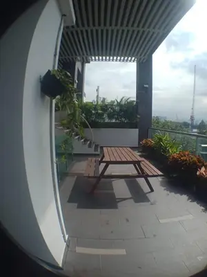 a picnic table on a balcony of a building at VUE RESIDENCES SERVICE SUITE 2 ROOMS DELUXE 6 Pax in Kuala Lumpur