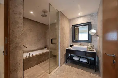 a bathroom with a tub and a sink and a shower at Lanson Place Bukit Ceylon in Kuala Lumpur
