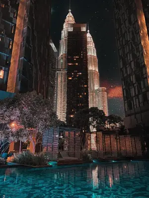 a view of a tall building at night at Like Home Star KLCC in Kuala Lumpur