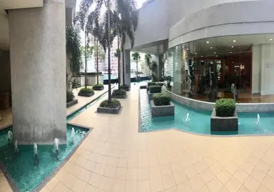 a lobby of a building with a swimming pool at Deluxe Swiss Garden Residences Bukit Bintang City Center in Kuala Lumpur