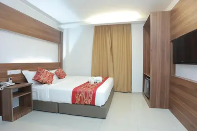 a hotel room with a bed and a flat screen tv at Bitz Bintang Hotel in Kuala Lumpur