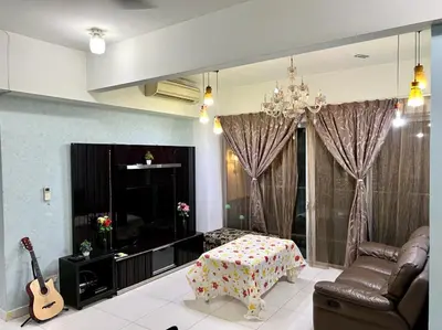 a living room with a couch and a guitar at Regalia Skypool KLCC in Kuala Lumpur