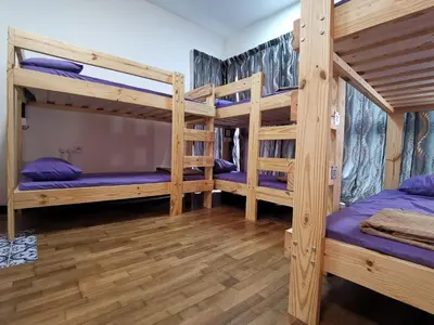 a room with three bunk beds in a cabin at Regalia Skypool KLCC in Kuala Lumpur