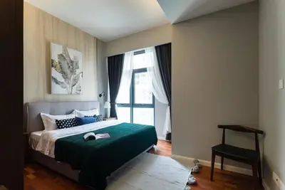 a bedroom with a bed and a large window at TriBeCa 2bedroom 3min walk to bukit bintang 2 rooftop pool in Kuala Lumpur