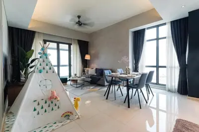 a living room with a childs play area with a christmas tree at TriBeCa 2bedroom 3min walk to bukit bintang 2 rooftop pool in Kuala Lumpur