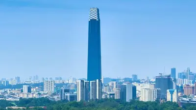 a view of a city with a tall skyscraper at Cozy Studio 10min to KLCC next to Hospital Gleneagle Jalan Ampang in Kuala Lumpur