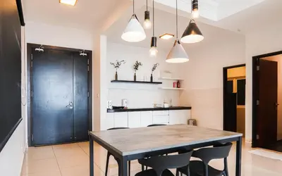 a dining room with a table and chairs at Boulevard Service Apartment KL by Airhost in Kuala Lumpur