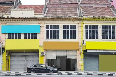 a black car parked in front of a building at Hotel O Shalimar in Kuala Lumpur