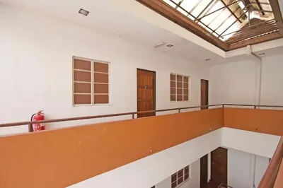 an empty room with a balcony and a skylight at Hotel O Shalimar in Kuala Lumpur