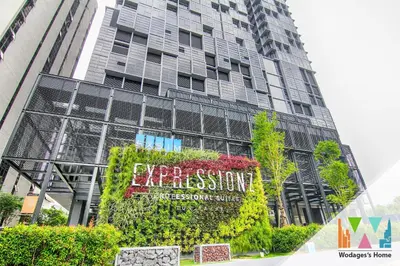 a tall building with a sign in front of it at KLCC Expressionz by WGS in Kuala Lumpur