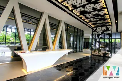 a lobby of a building with a large white table at KLCC Expressionz by WGS in Kuala Lumpur