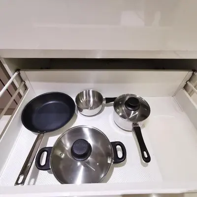 a stove top with three pots and pans on it at Sky Pool Elegant Suite @ Sri Hartamas in Kuala Lumpur