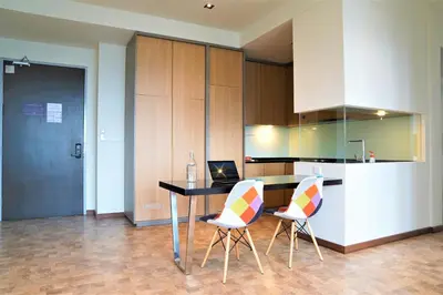 a kitchen with a table and two chairs at ExpressionZ Suites KLCC in Kuala Lumpur