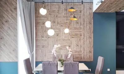 a dining room with a table with chairs and lights at ExpressionZ Suites KLCC in Kuala Lumpur