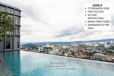 a swimming pool with a view of a city at KLCC View Expressionz Family Loft by WGS in Kuala Lumpur